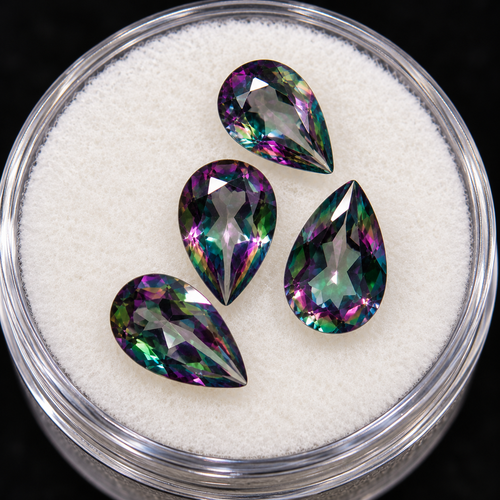 Stylized promotional enhancement of pear cut mystic topaz, with subdued rainbow colors
